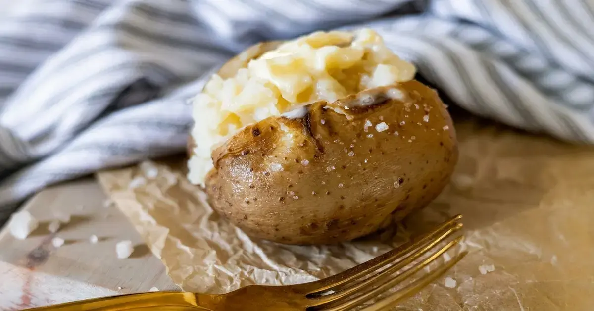 Learn how easy it is to come home to perfect baked potatoes with this crock pot baked potatoes recipe! It's almost too good to be true!