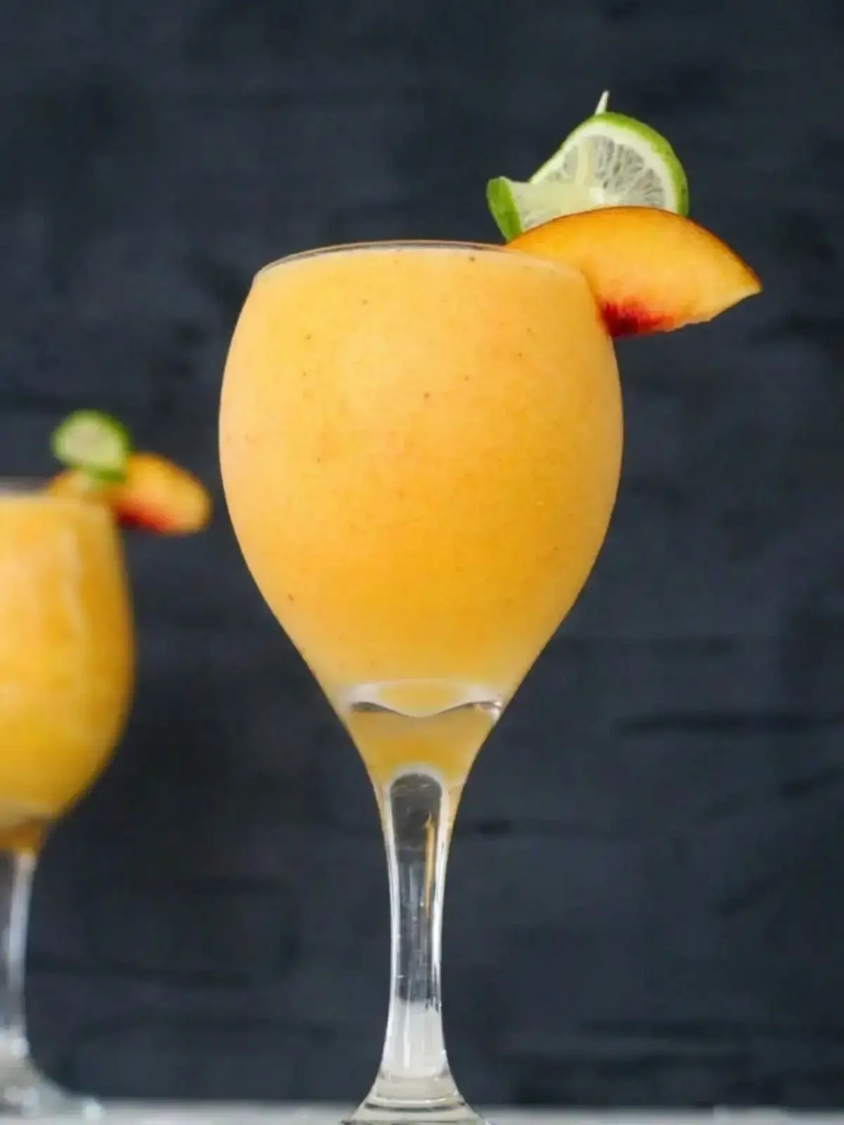 15 Frozen Peach Recipes to Enjoy All Year Long 1 1. Peach and Mango Daquiri