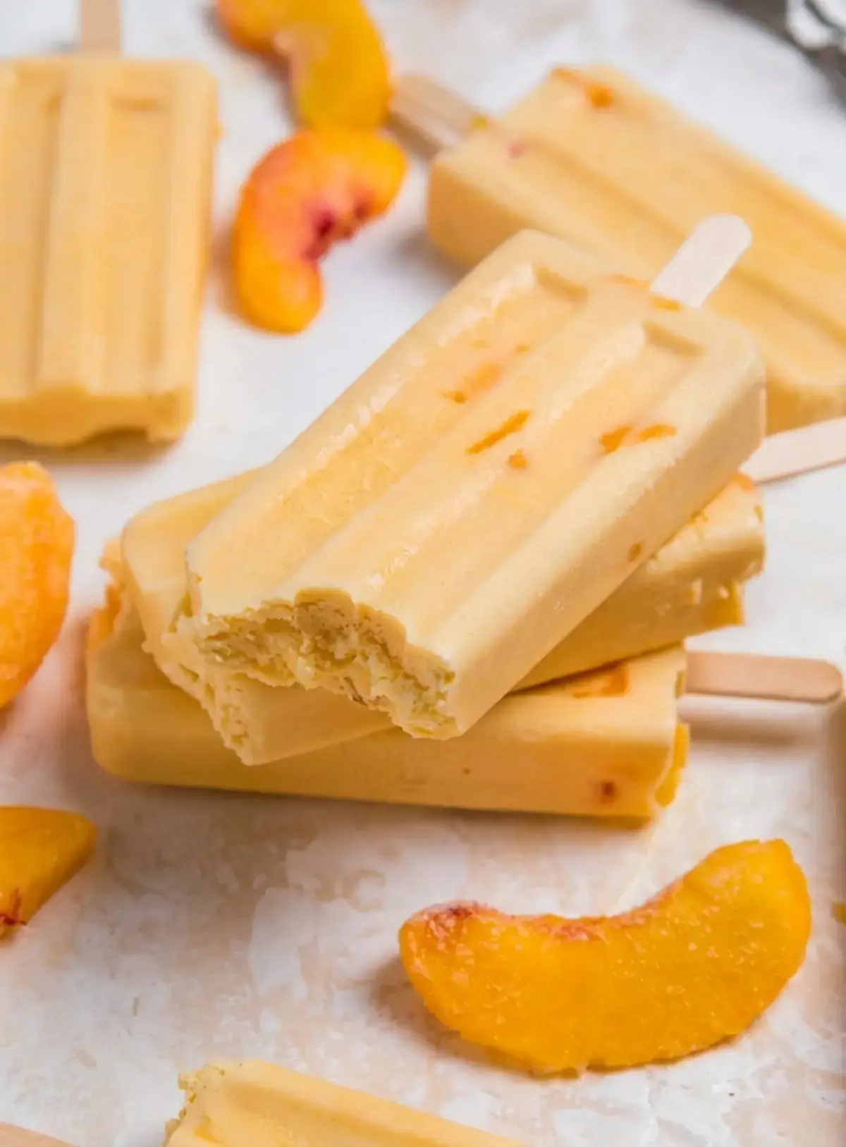 15 Frozen Peach Recipes to Enjoy All Year Long 4 4. Creamy Peach Popsicles