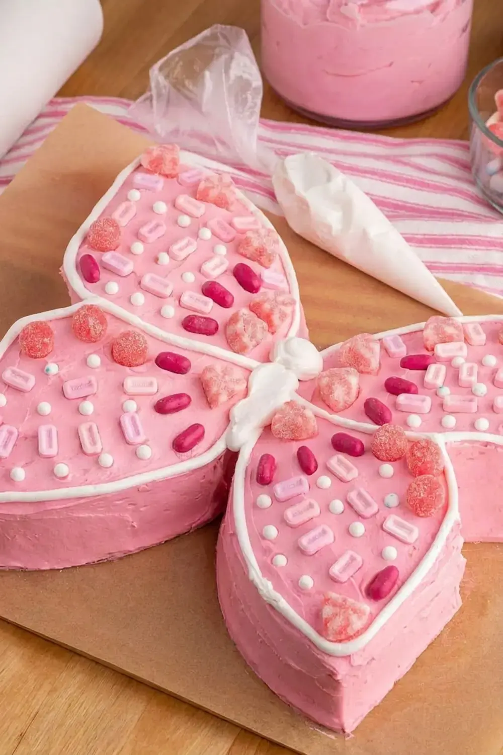Using just a box of cake mix, premade icing, and a few simple steps, you can transform an ordinary cake into a fluttering butterfly cake that will wow everyone at your table!