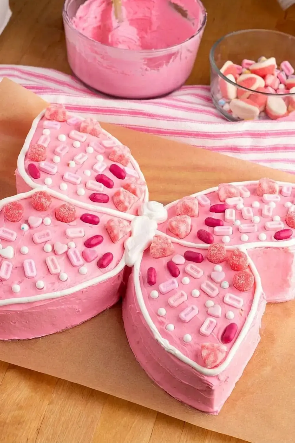 Using just a box of cake mix, premade icing, and a few simple steps, you can transform an ordinary cake into a fluttering butterfly cake that will wow everyone at your table!