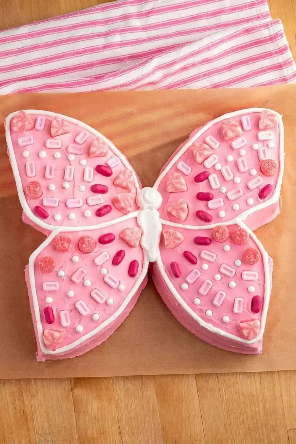Using just a box of cake mix, premade icing, and a few simple steps, you can transform an ordinary cake into a fluttering butterfly cake that will wow everyone at your table!