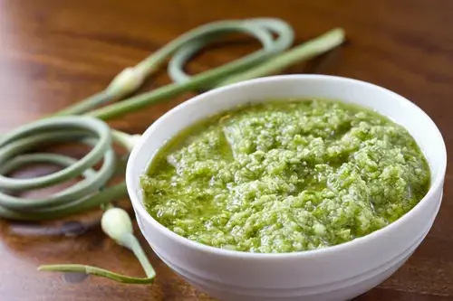8 Great Garlic Scape Recipes for Pesto, Hummus, and More 2 Bundle of green garlic scapes from the garden