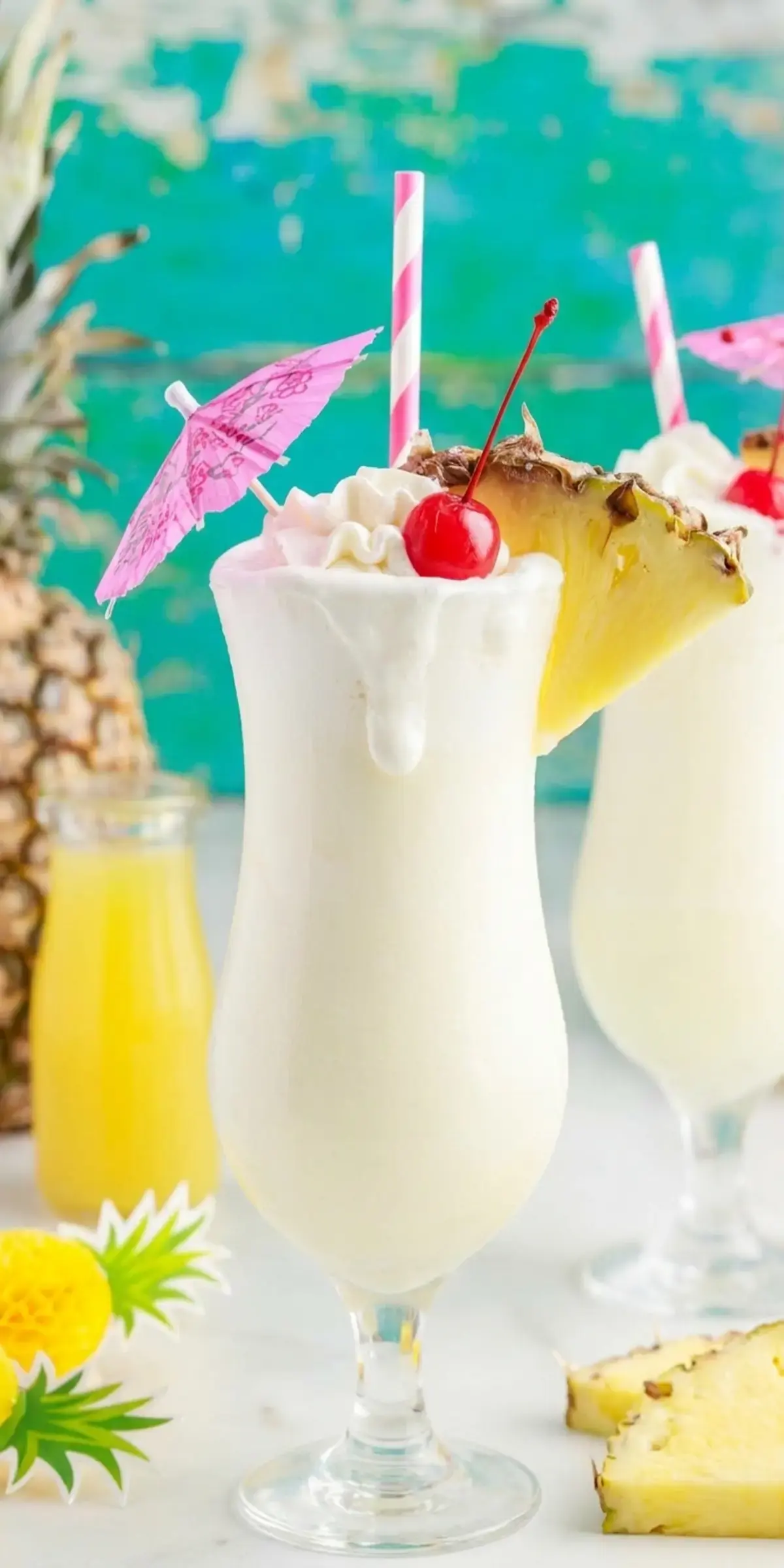 Pineapple wedge garnishing creamy pina colada