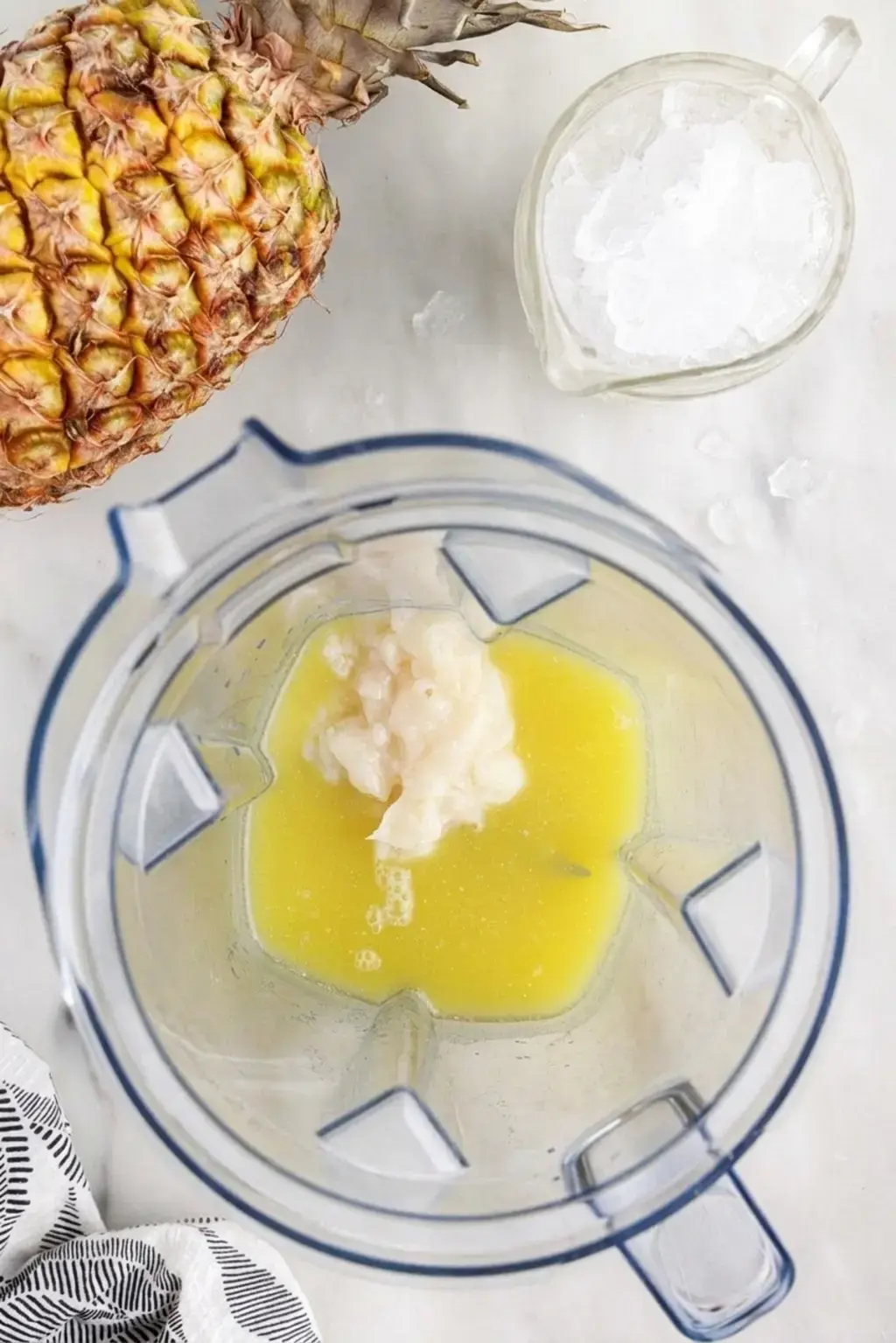 Chilled glasses and pineapple garnish ready for frozen cocktails