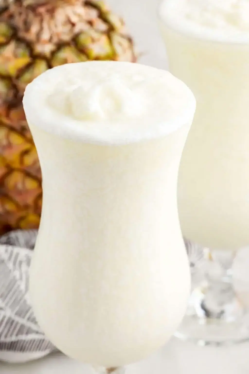 Coconut rum measured into pina colada blender