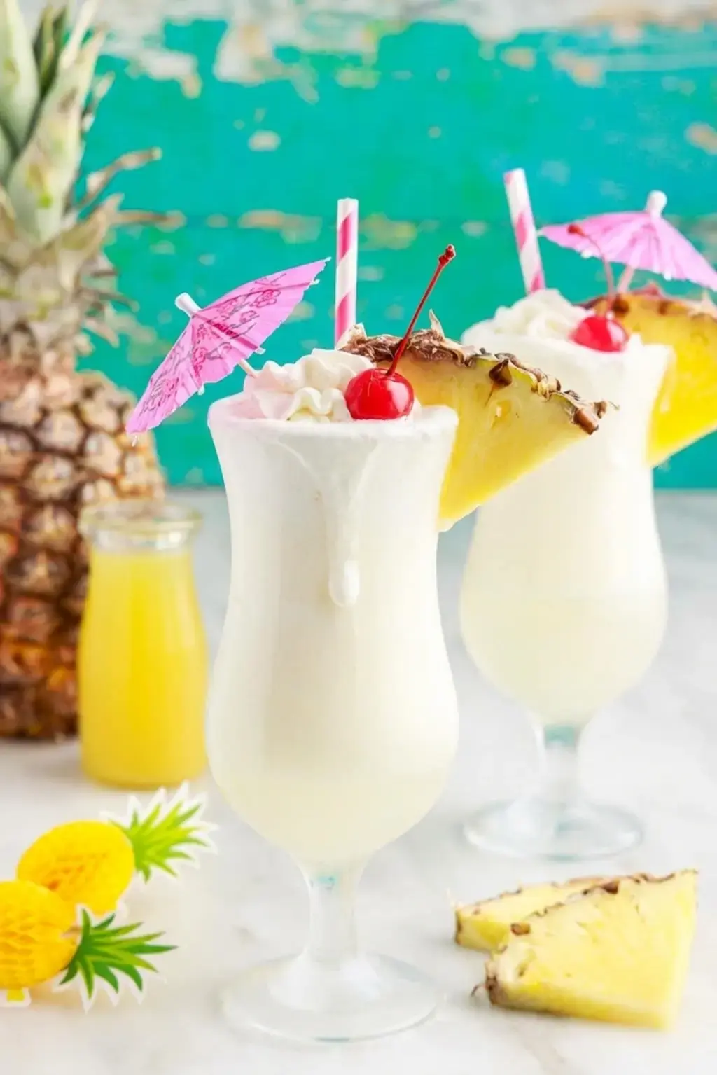 Small ice cubes added to coconut and pineapple mixture
