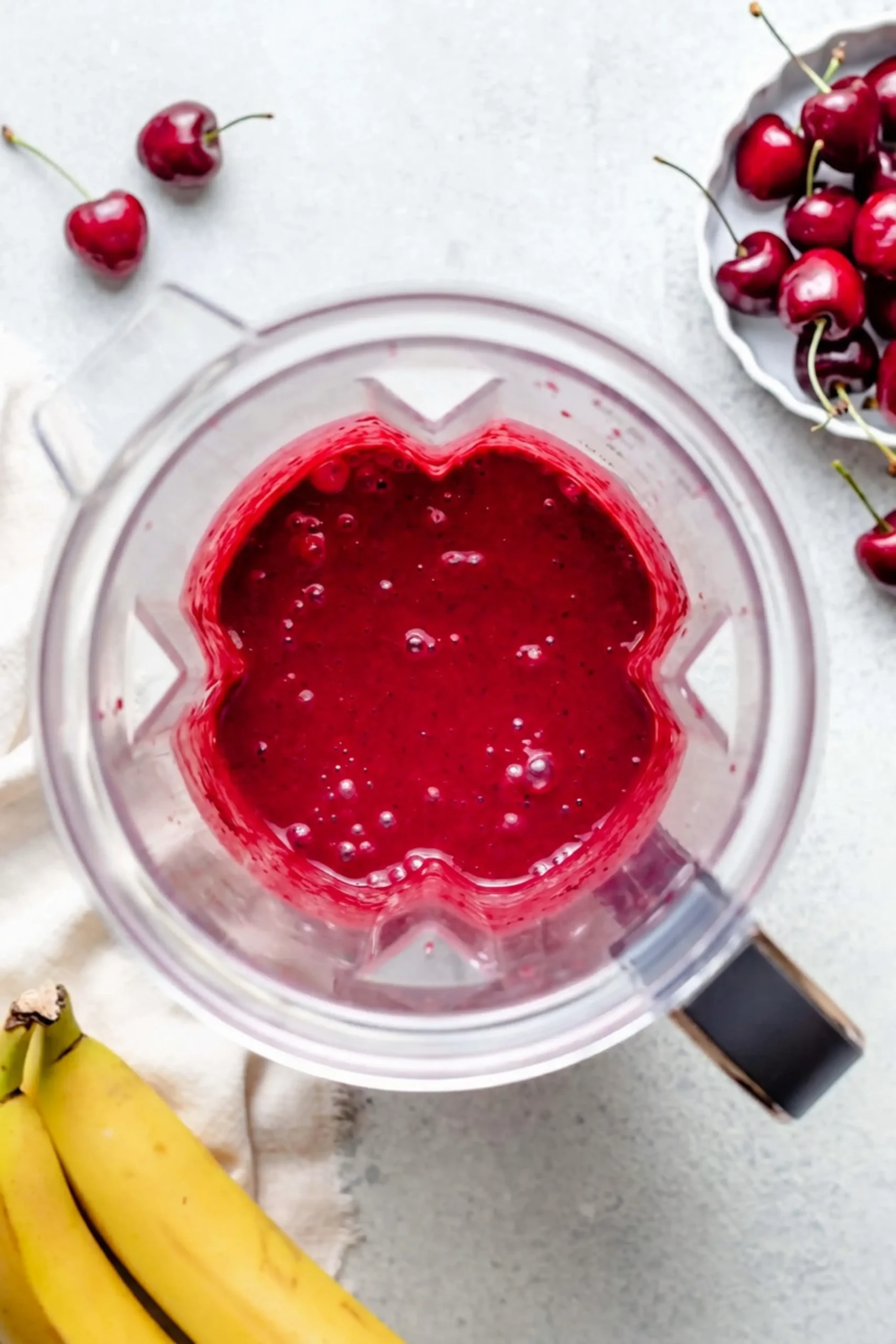 Frozen cherries banana and Greek yogurt in a blender