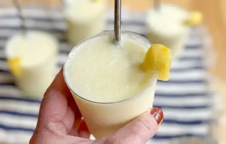 Creamy keto pina colada in a chilled glass
