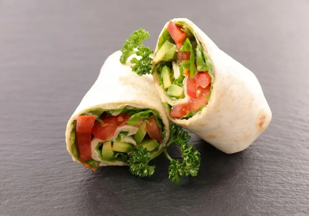 15 Easy Bento Box Meal Ideas for Adults 3 Bento Box Meal Ideas For Adults, Turkey Wraps, Veggie Sticks, and Hummus