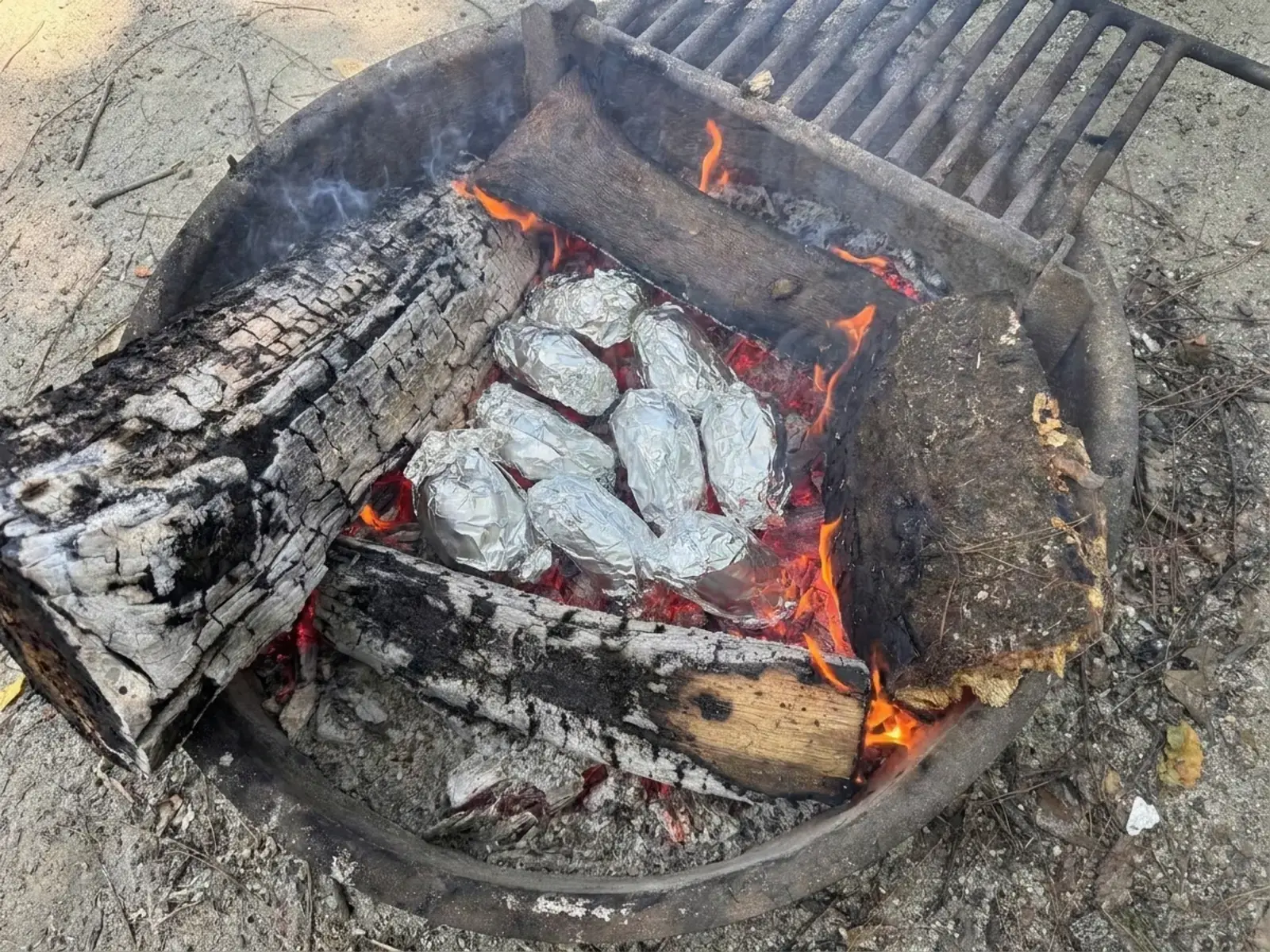 Campfire Baked Potatoes With Easy Loaded Toppings 10 Glowing campfire embers ready for foil-wrapped potatoes