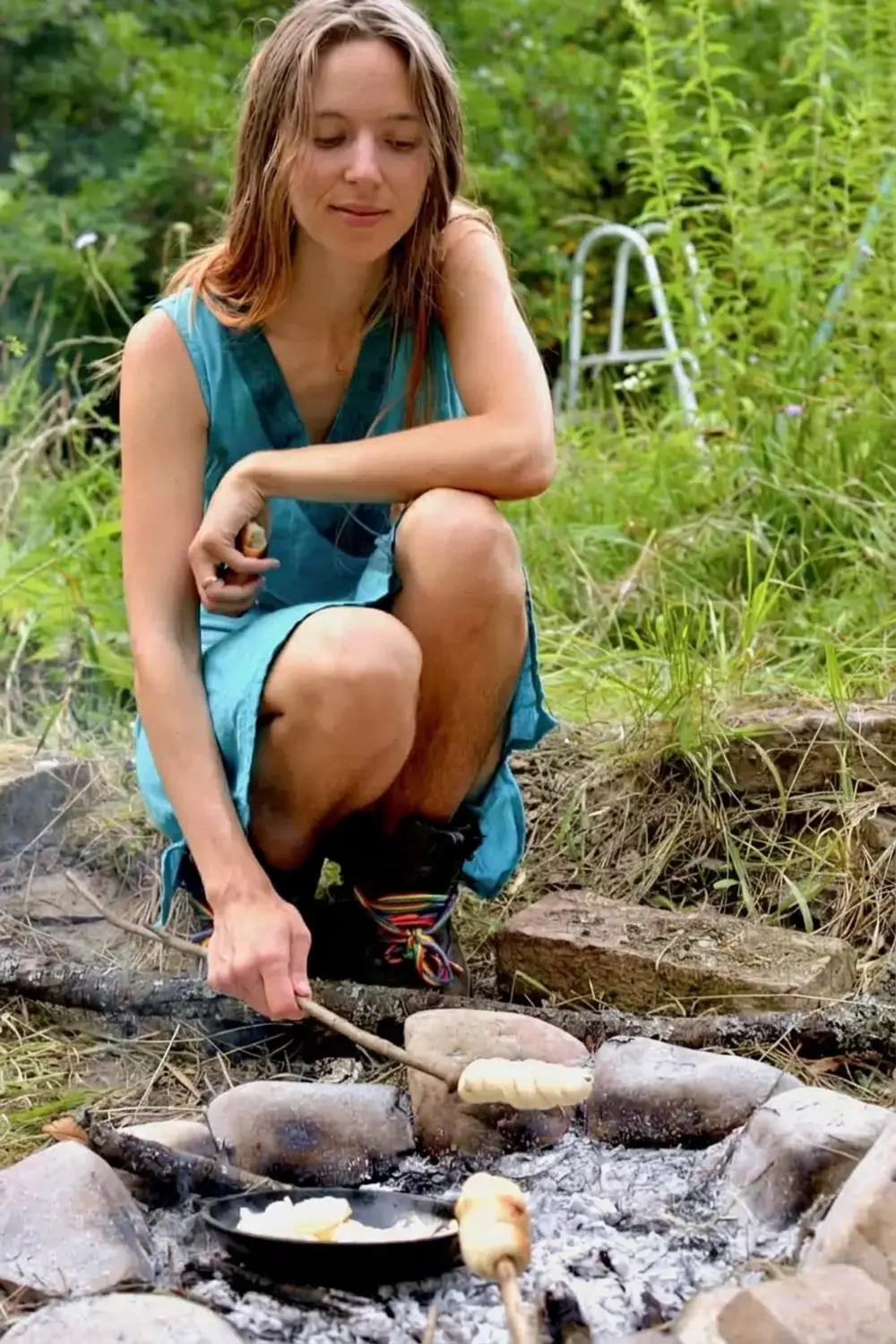 Campfire bread dough rising in a covered bowl