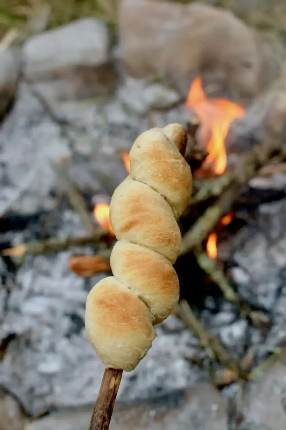 Campfire bread rotated for even browning