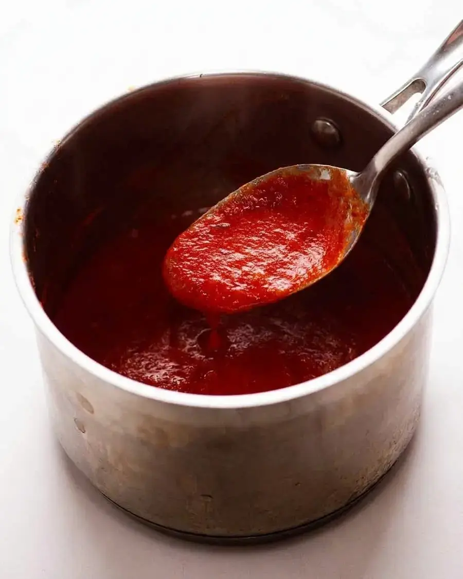Thick smooth tomato sauce simmering