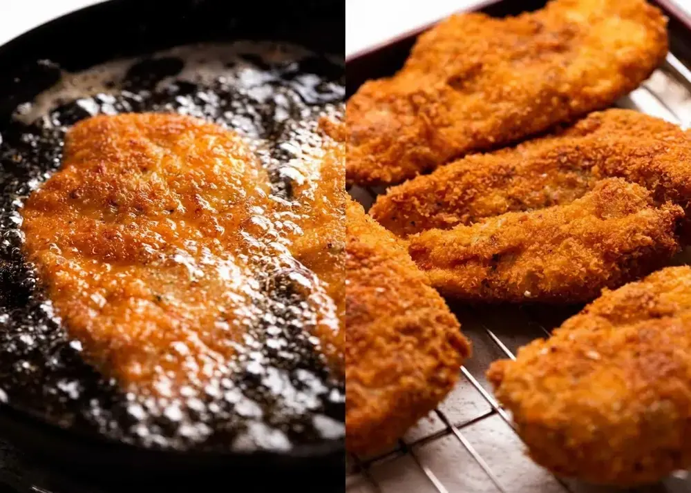 Golden crumbed chicken draining on a wire rack