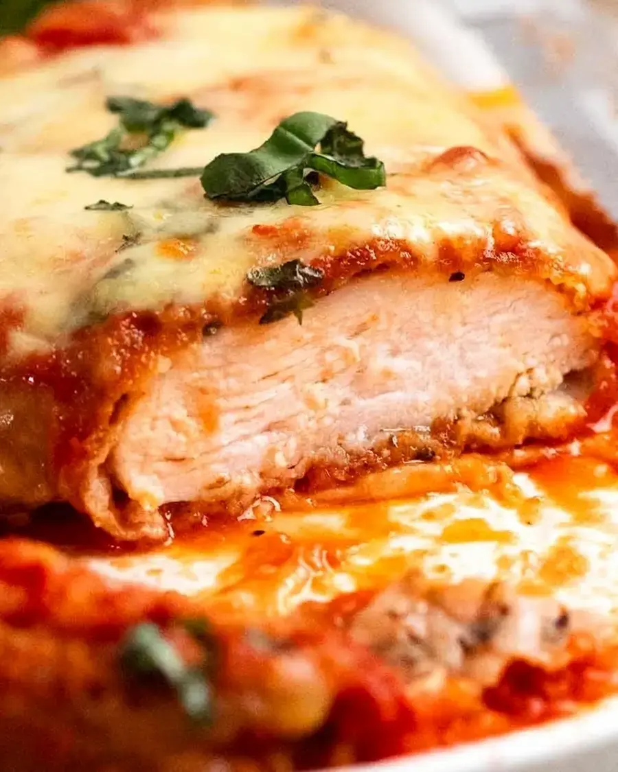 Chicken Parmesan served with basil