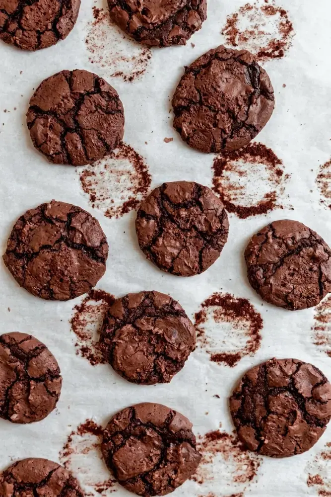Baked brownie cookies with shiny crinkled tops