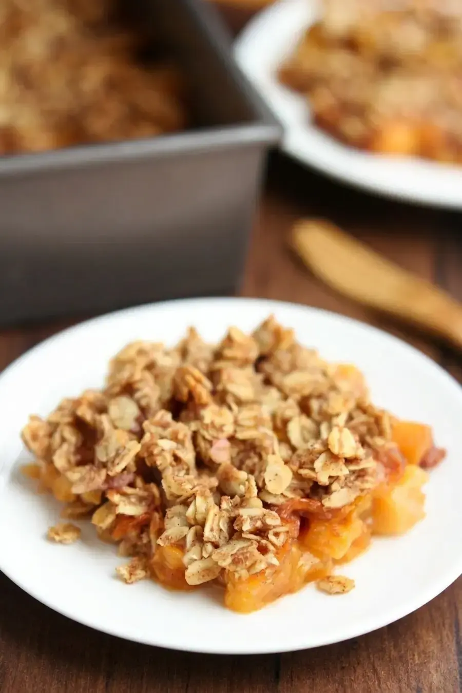 Clean Peach Crumble With Juicy Fruit and Oat Topping 15 Maple syrup and melted butter mixed into oat topping