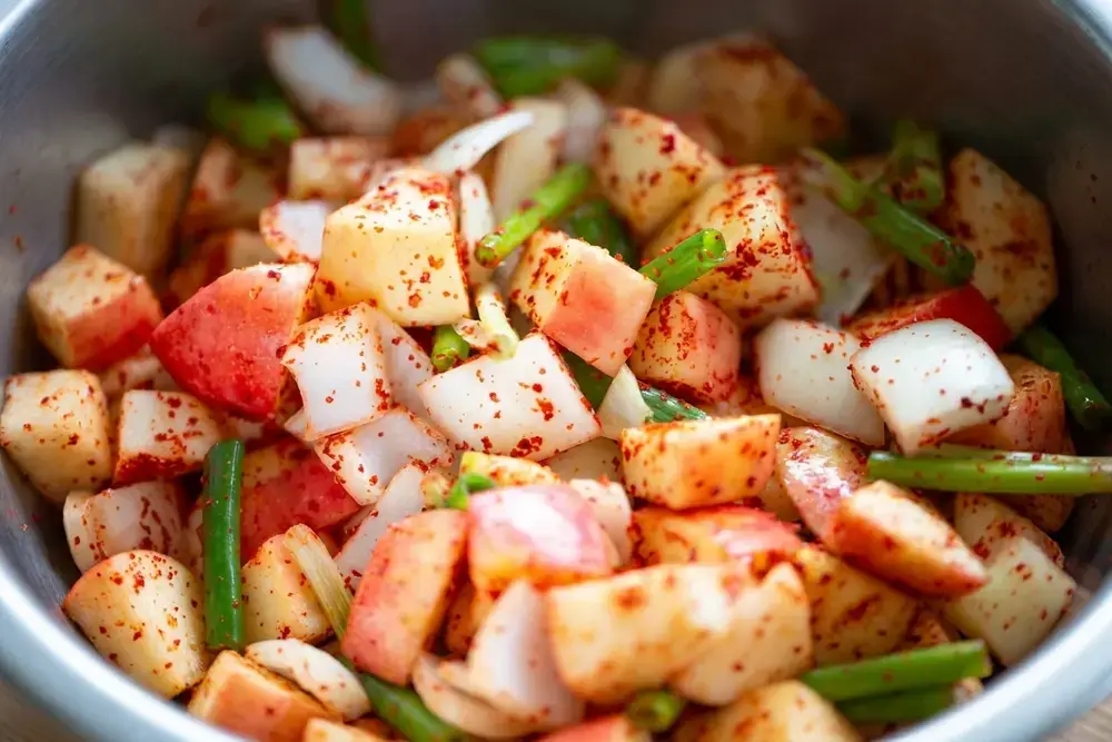 Easy Apple Kimchi: Sweet-Spicy 20-Minute Recipe 13 Prepared apples onions garlic and ginger for kimchi