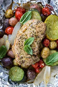 Foil Pack Meals Oven Grill Campfire Recipes for Easy Dinners 24 Pesto Pork Chop and Summer Vegetable Foil Dinners