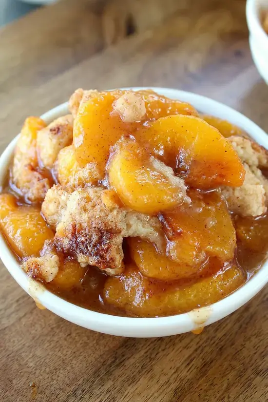 Fresh Peach Cobbler With Cinnamon-Sugar Topping 14 Peach filling pre-baking in an ungreased baking dish