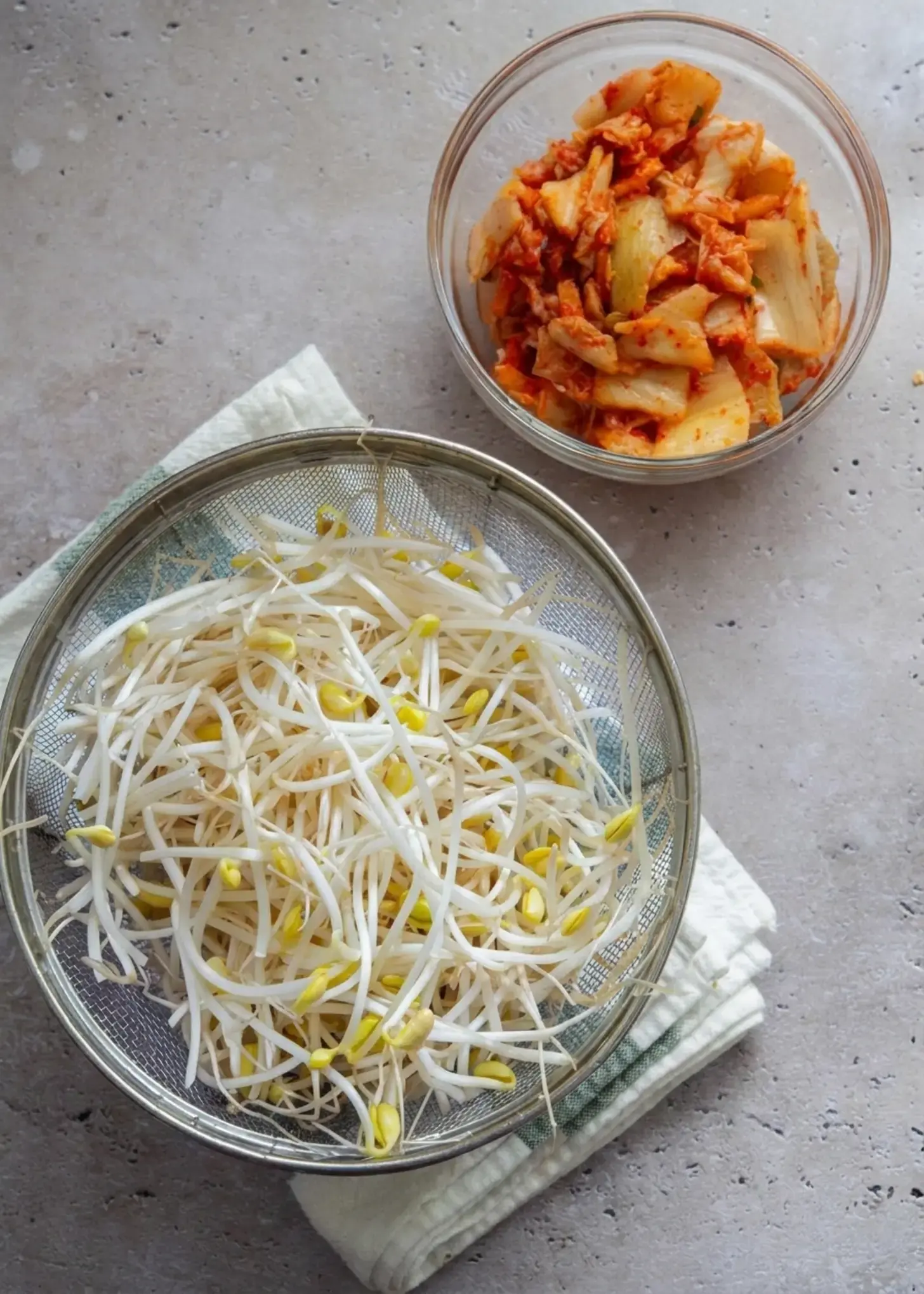 Ingredients for kimchi bean sprout soup arranged together