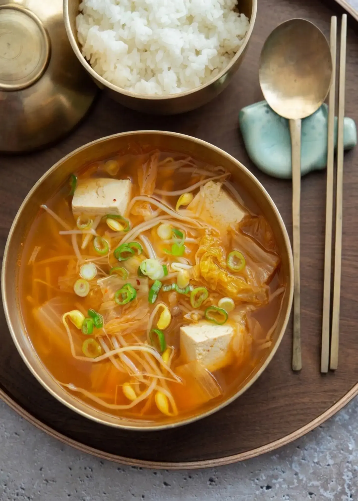 Kimchi bean sprout soup served hot beside rice