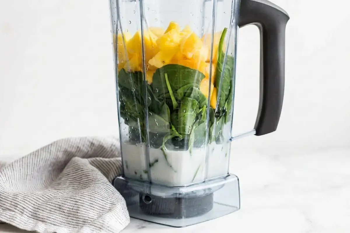 Make Smoothie Recipes at Home: 35+ Fresh Ideas 6 Smoothie ingredients layered correctly in a blender