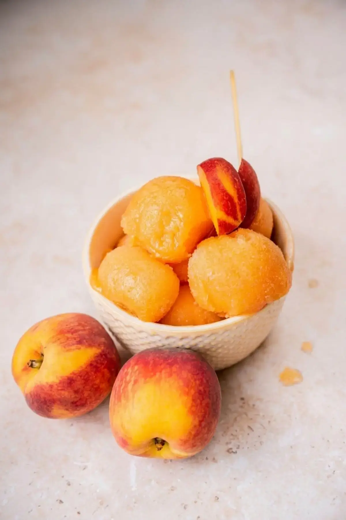 Cold water poured into the peach sorbet mixture