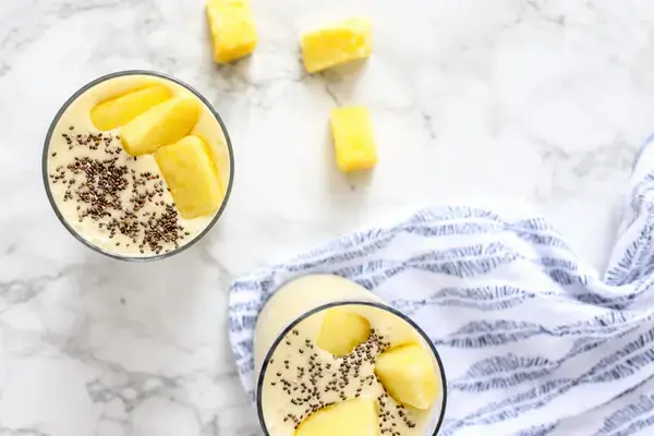 Ripe banana and pineapple prepared for blending
