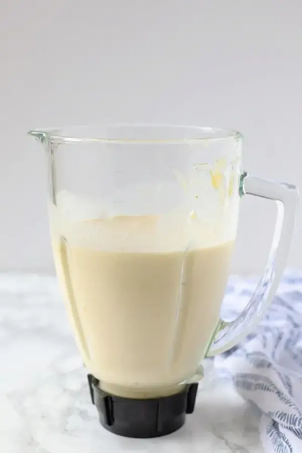 Finished tropical pina colada smoothie poured into a glass