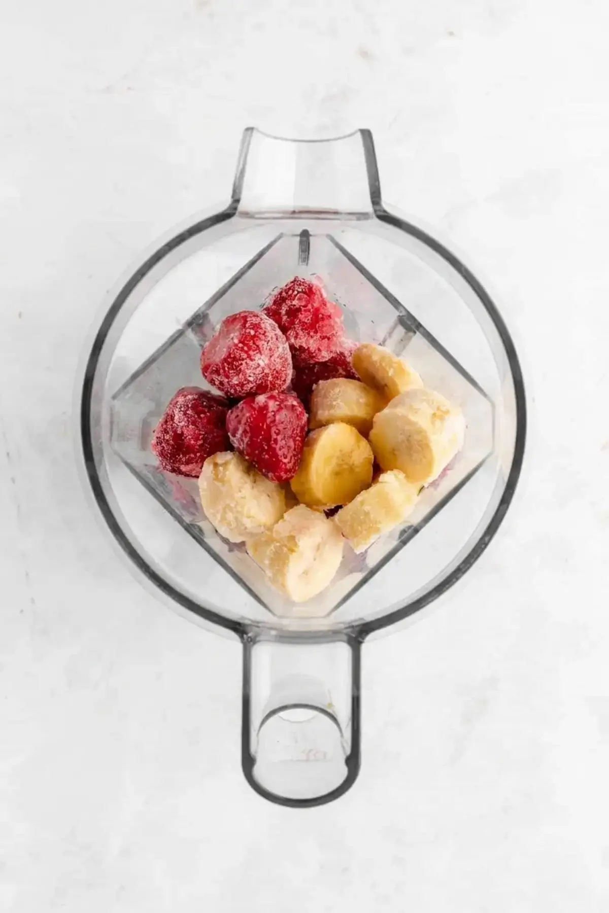 Strawberry Banana Smoothie Bowl 4 Smoothie bowl ingredients placed in a blender