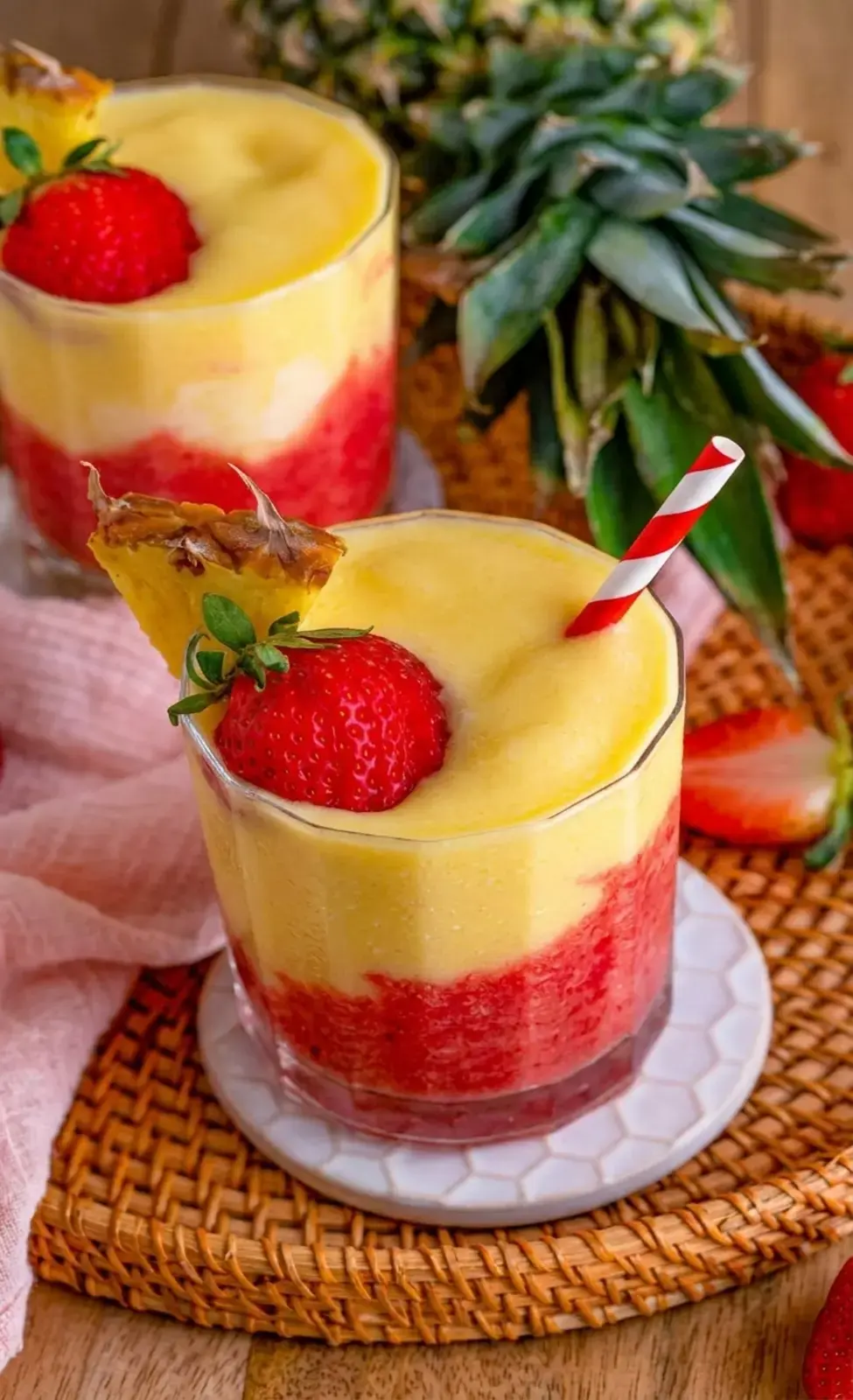 Strawberry cocktail layer divided between two glasses