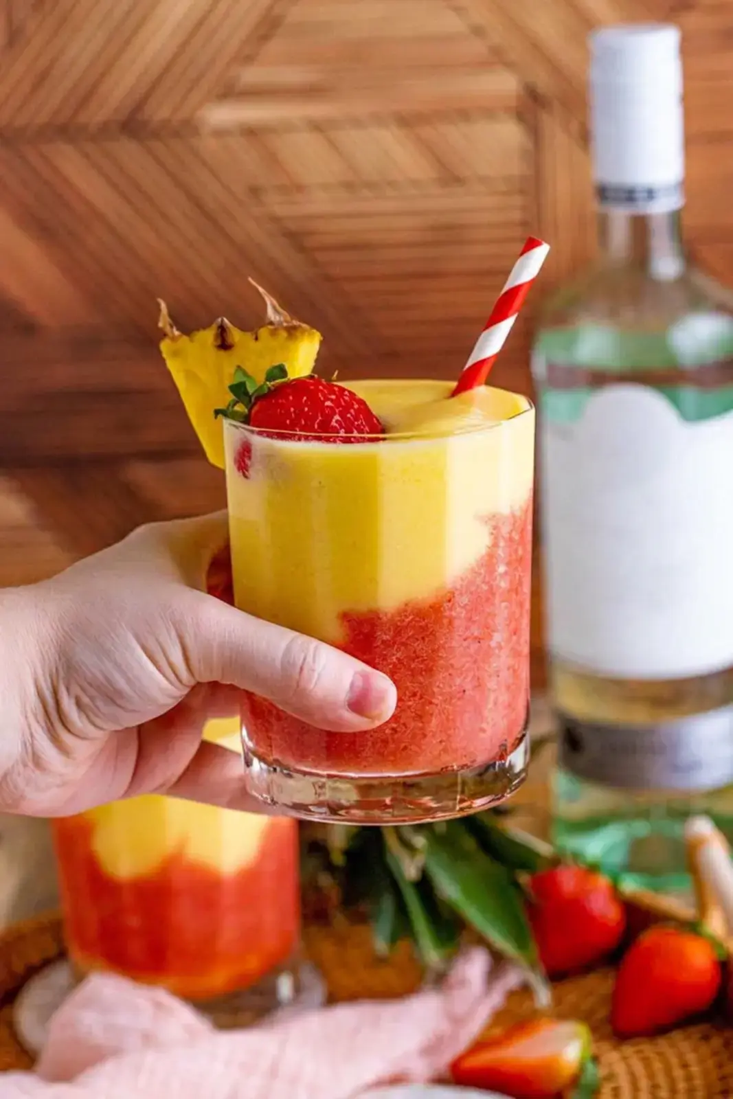 Finished strawberry pina colada with fruit garnishes
