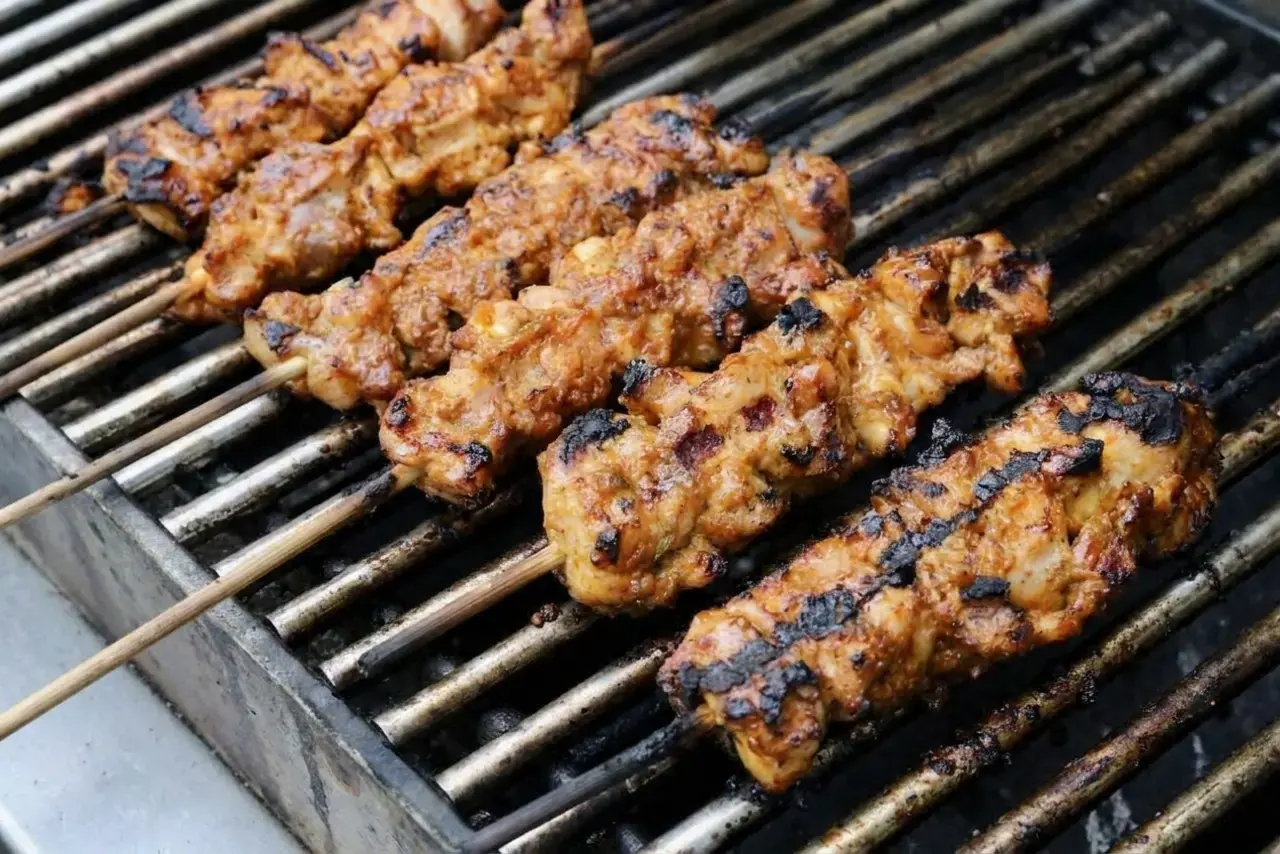 Tavuk Sis Turkish Chicken Kebab with Pepper Sauce 7 Tavuk sis skewers grilling until evenly charred