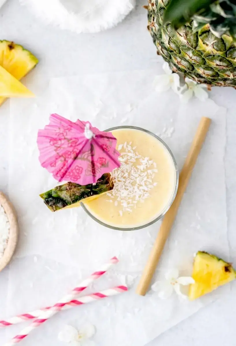 Tropical Almond Colada Smoothie With Pineapple and Coconut 6 Pineapple smoothie blending until smooth and creamy