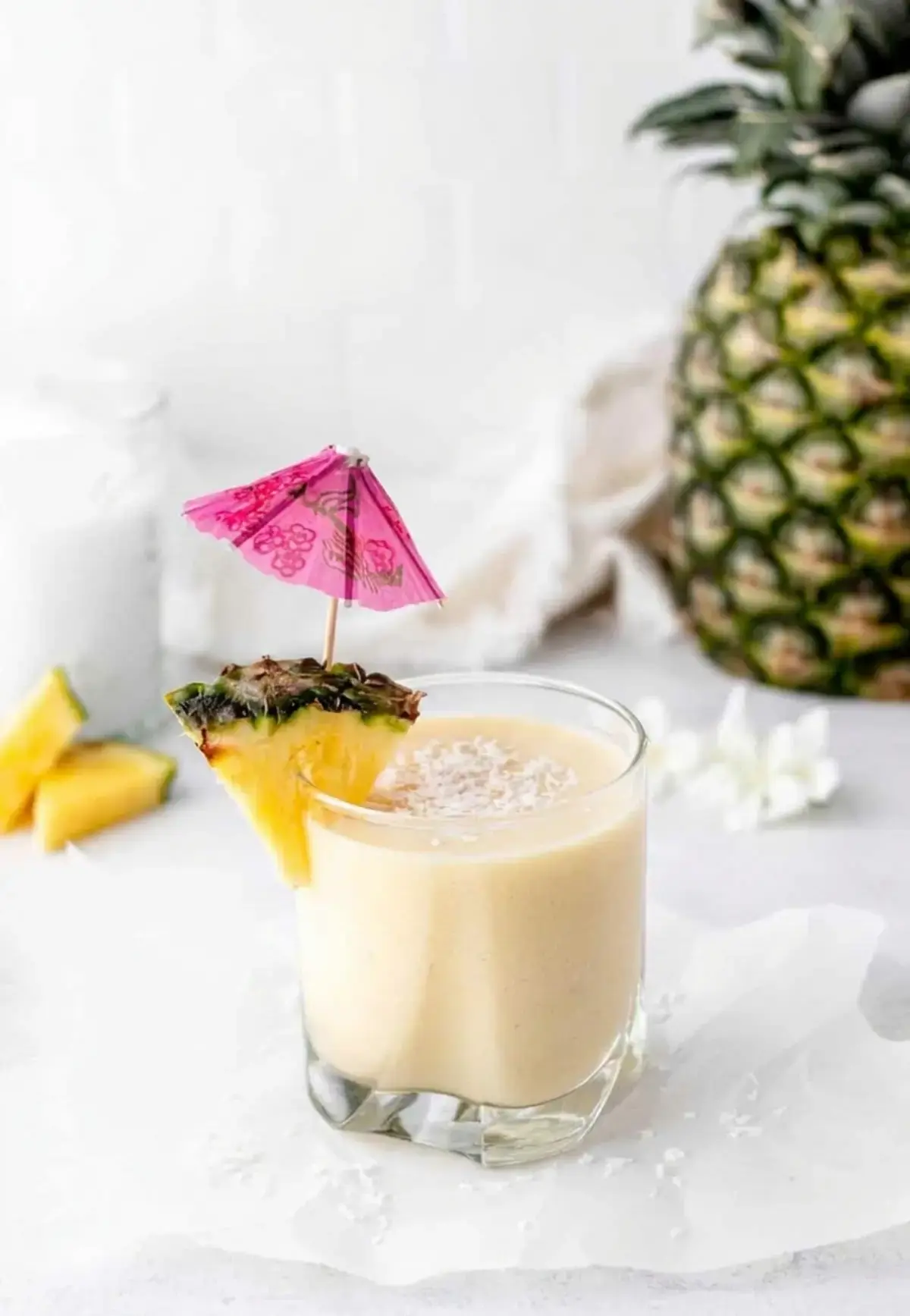 Tropical Almond Colada Smoothie With Pineapple and Coconut 1 Tropical pineapple and coconut smoothie served cold