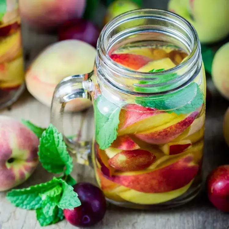 35 Fruit-Infused Water Recipes for Healthy, Sugar-Free Hydration 23 35 Fruit-Infused Water Recipes, Mint, Peach and Plum