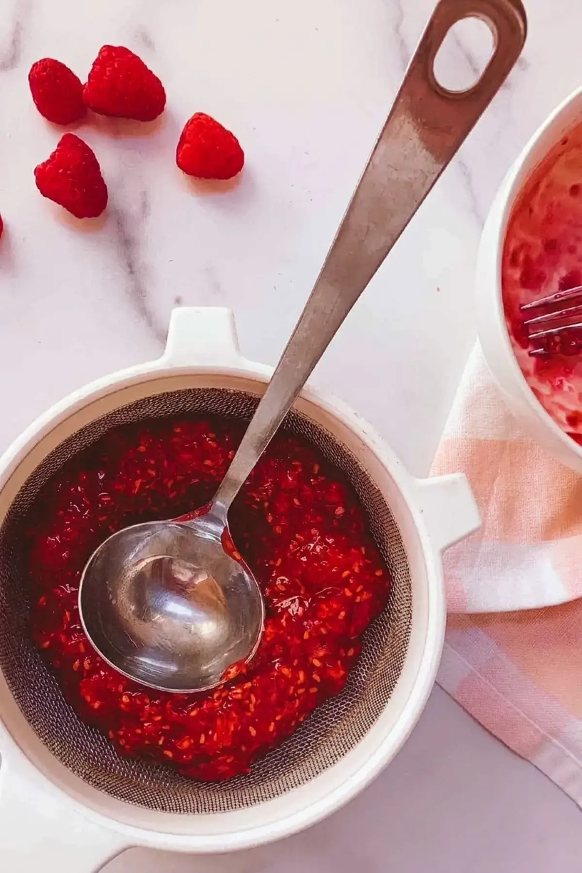 4 Easy Raspberry Sauce Recipes for Every Dessert 8 4 Easy Raspberry Sauce Recipes, Step 2: Strain out the seeds