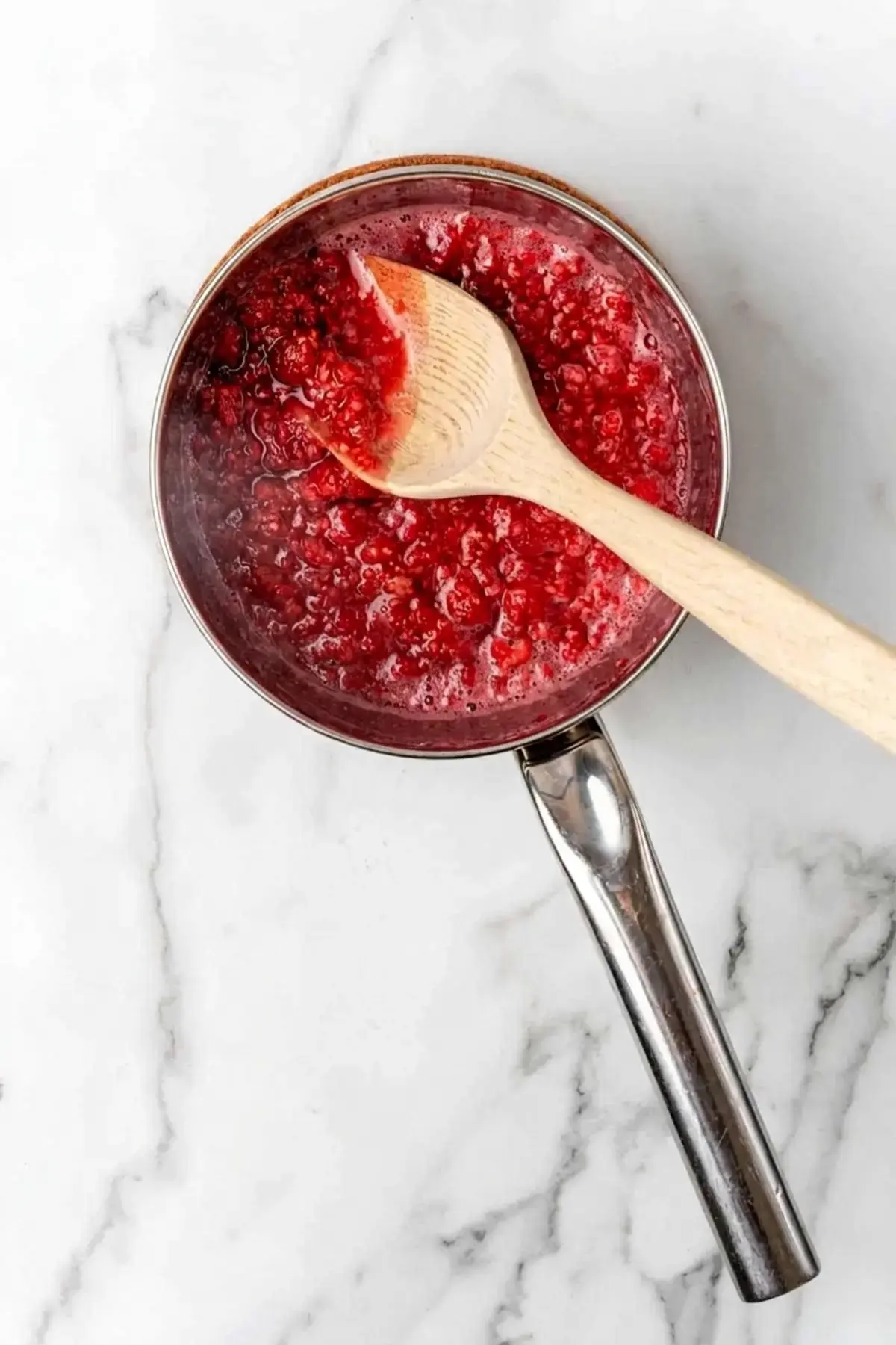4 Easy Raspberry Sauce Recipes for Every Dessert 7 4 Easy Raspberry Sauce Recipes, Step 2: Strain out the seeds