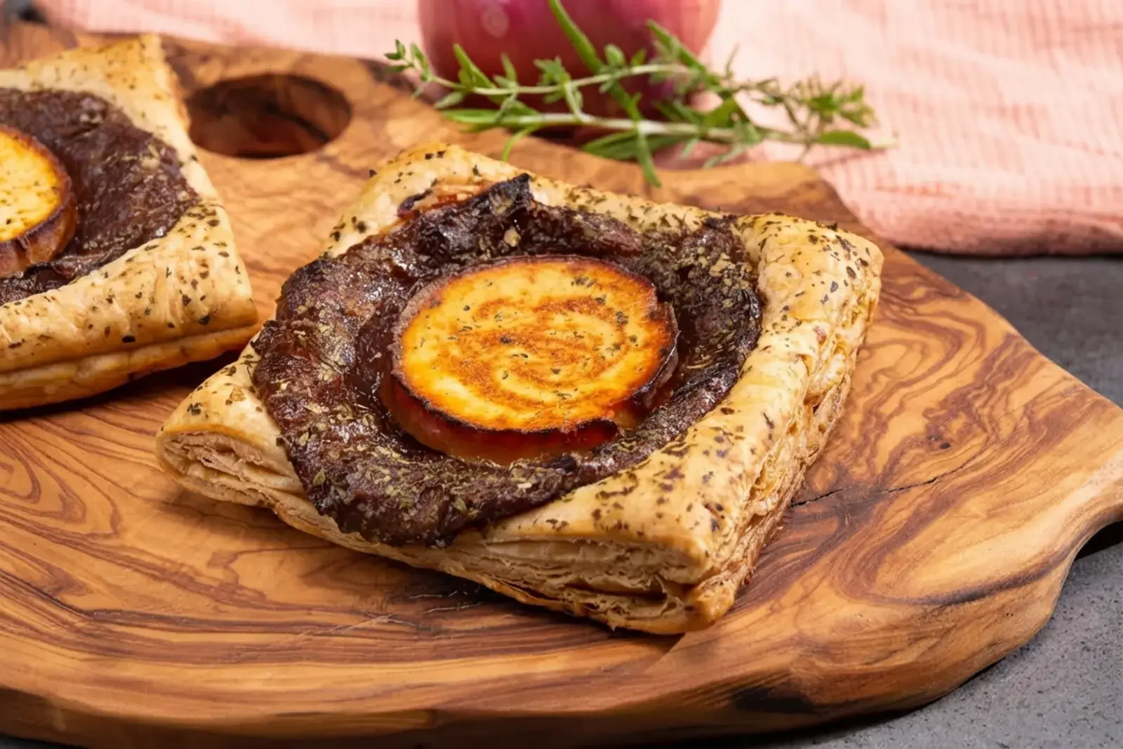 23 Easy Puff Pastry Appetizers, 6) Caramelized Onion and Goat Cheese Tarts