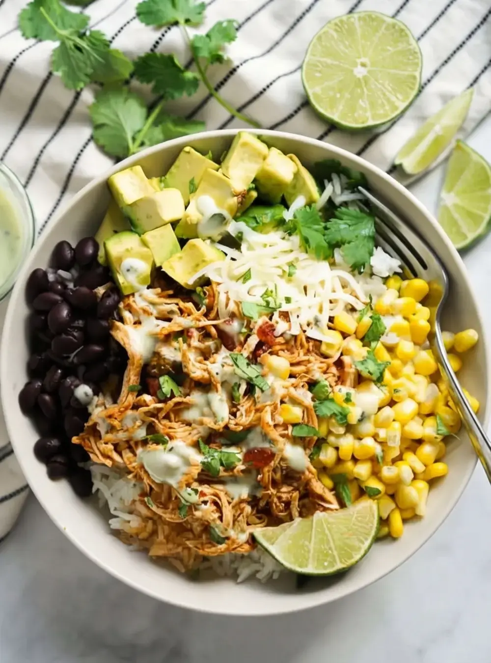 30+ Cheap Crockpot Recipes For Easy Comfort Meals, 22. Chicken Burrito Bowl