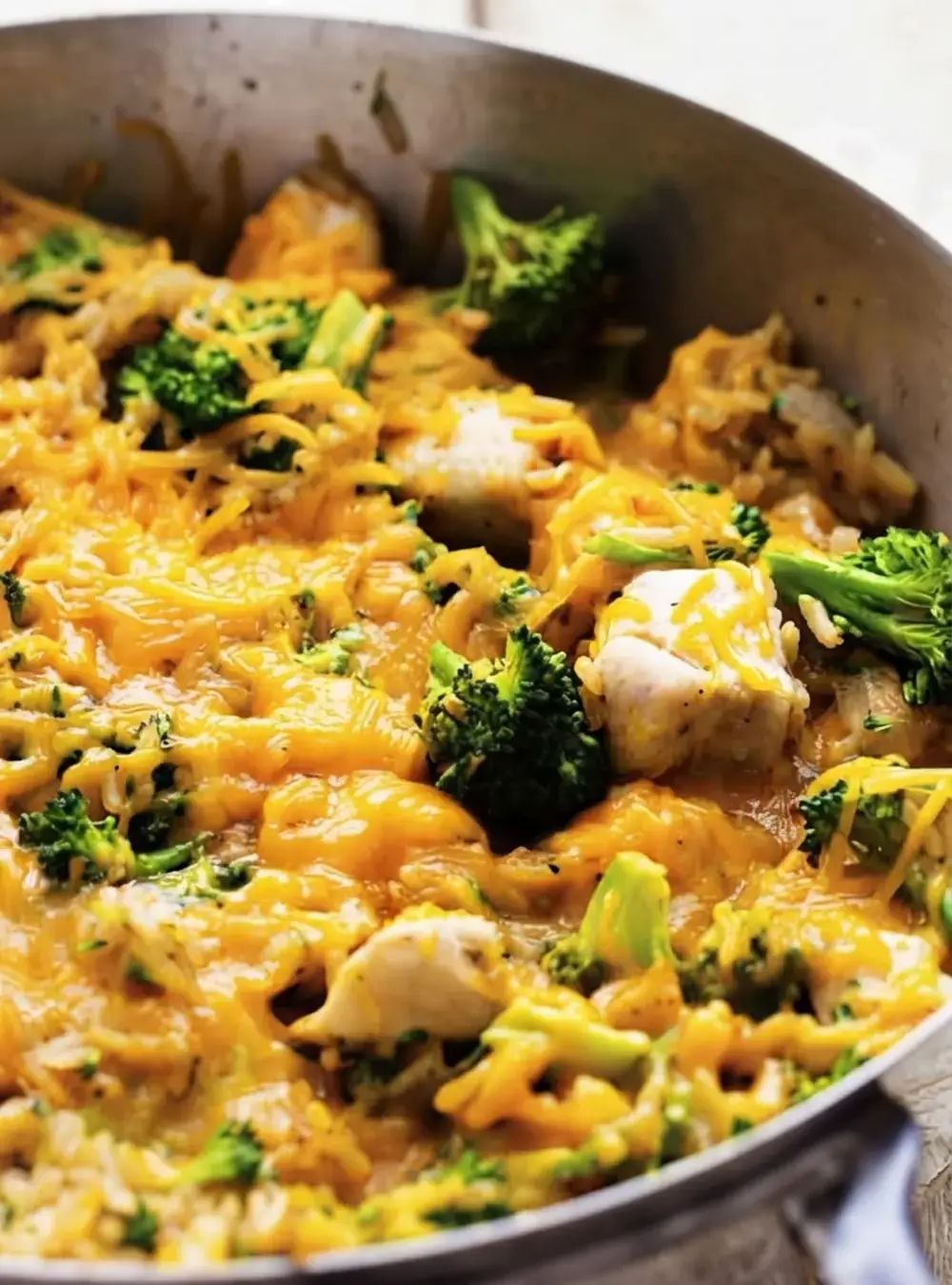 30+ Cheap Crockpot Recipes For Easy Comfort Meals, 25. Cheesy Chicken with Broccoli and Rice