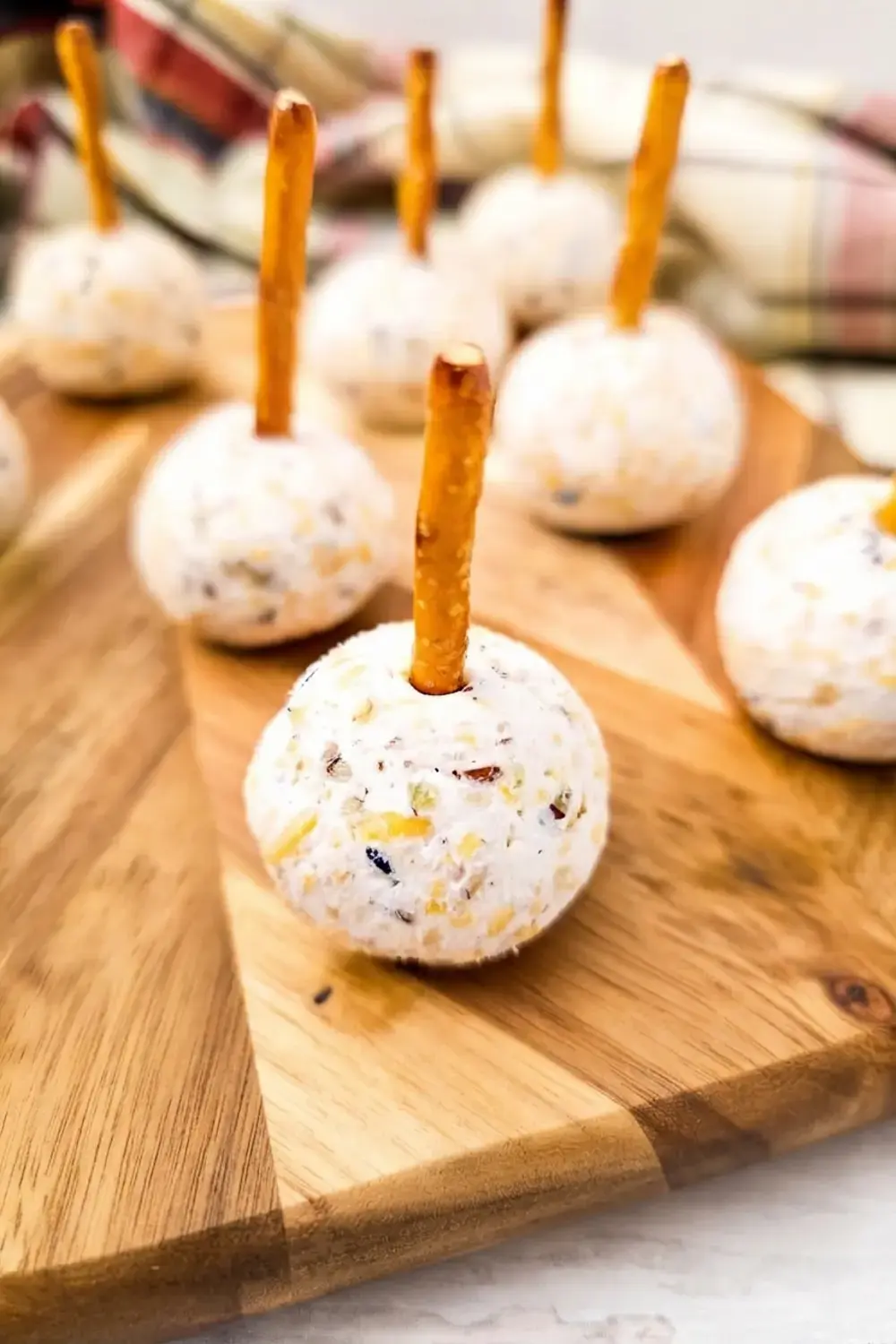 30+ One Bite Appetizers for a Crowd: Easy Finger Foods for Any Party 13 30+ One Bite Appetizers For A Crowd, Cheeseball Bites on Pretzel Sticks