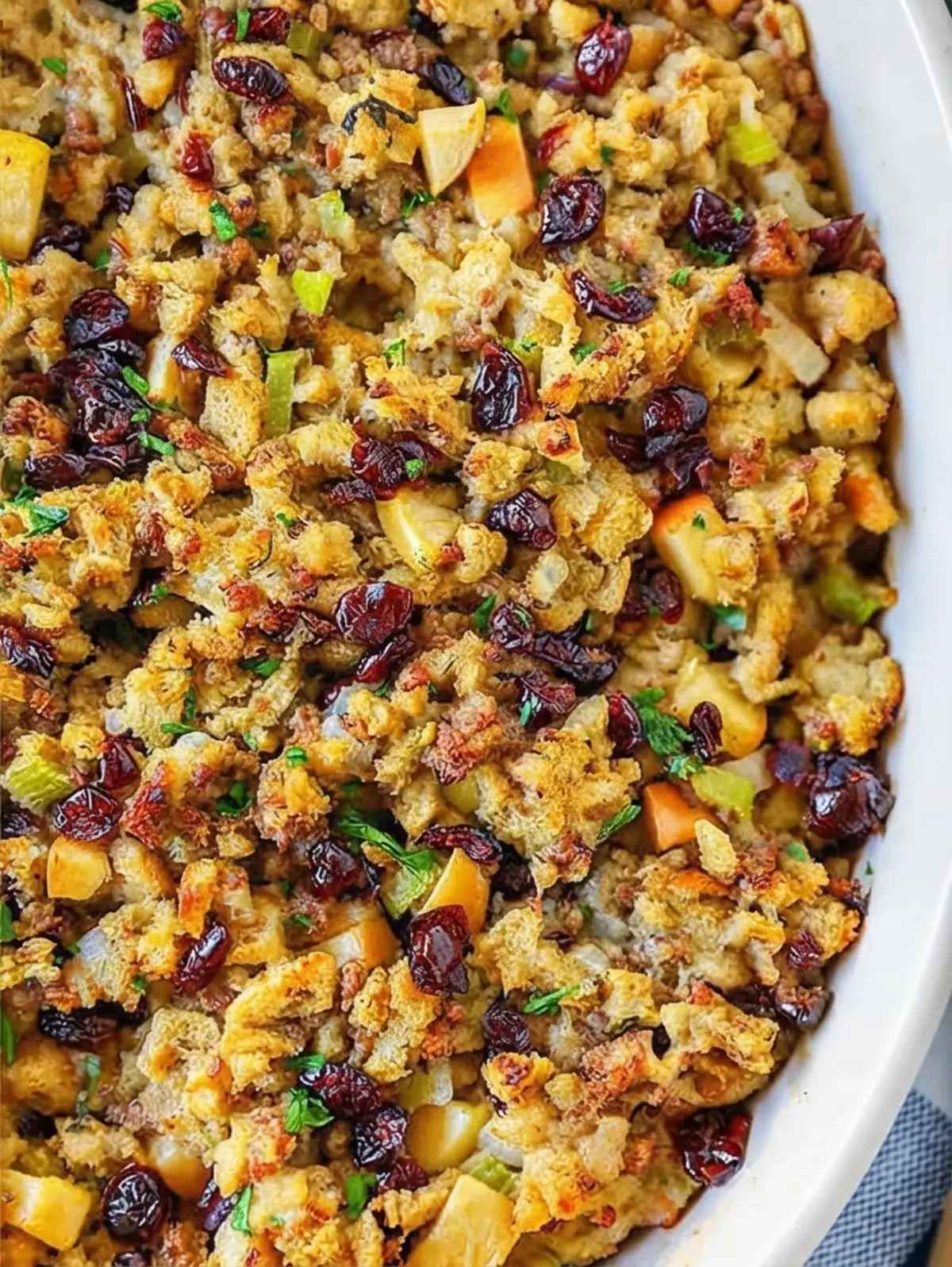 35 Delicious Holiday Dishes To Make Spirits Bright: Festive Recipes for Appetizers, Sides, and Desserts 4 35 Delicious Holiday Dishes To Make Spirits Bright, Cranberry Sausage Apple Stuffing