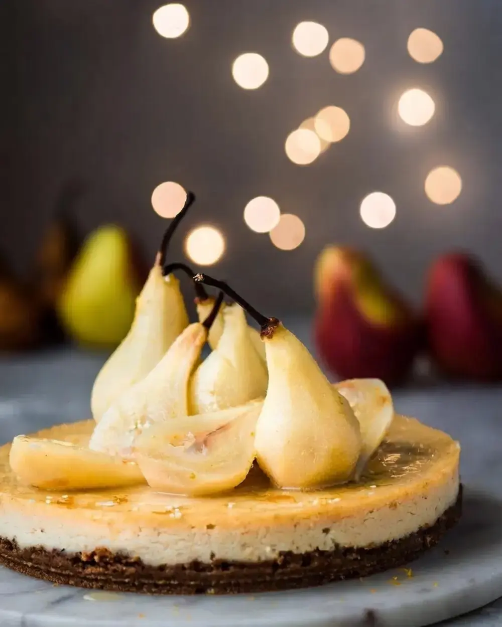 51 Christmas Baking Ideas for Cookies, Cakes, and Festive Desserts 27 51 Christmas Baking Ideas, 27. Ginger-Orange Vegan Cheesecake with Poached Pears