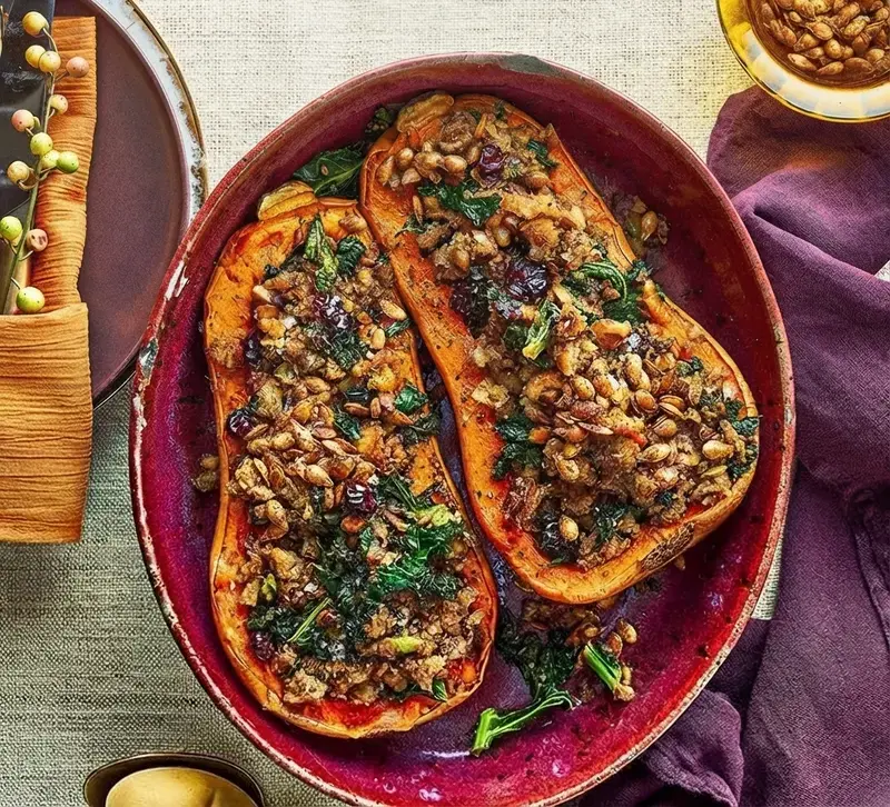 Delicious Christmas Recipes for a Plant-Based Holiday Table 13 Delicious Christmas Recipes, 11) Whole Roasted Butternut Squash with Christmas Stuffing