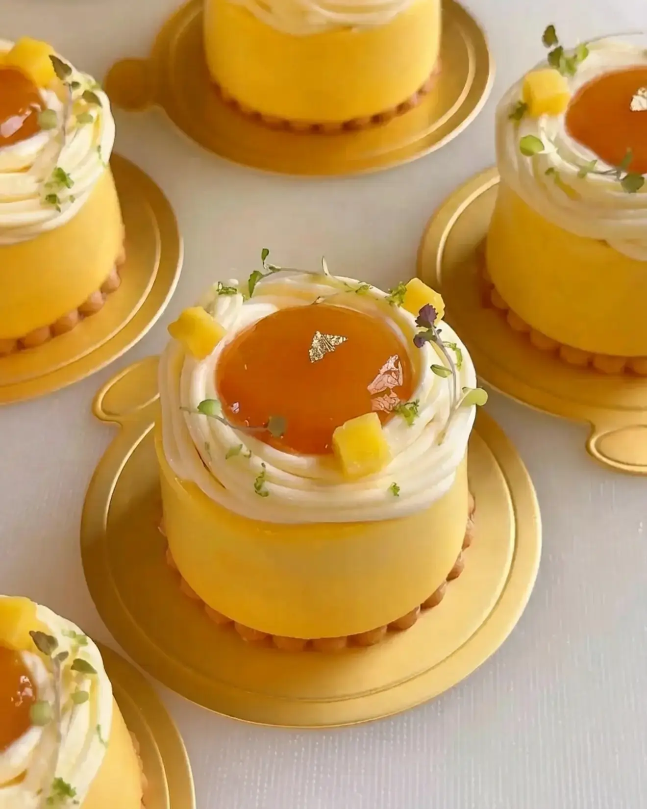 Mango Passion Fruit Coconut Entremet, With mango coconut mousse, mango passion fruit compote, vanilla sponge, passion fruit cremeux, and lime whipped ganache