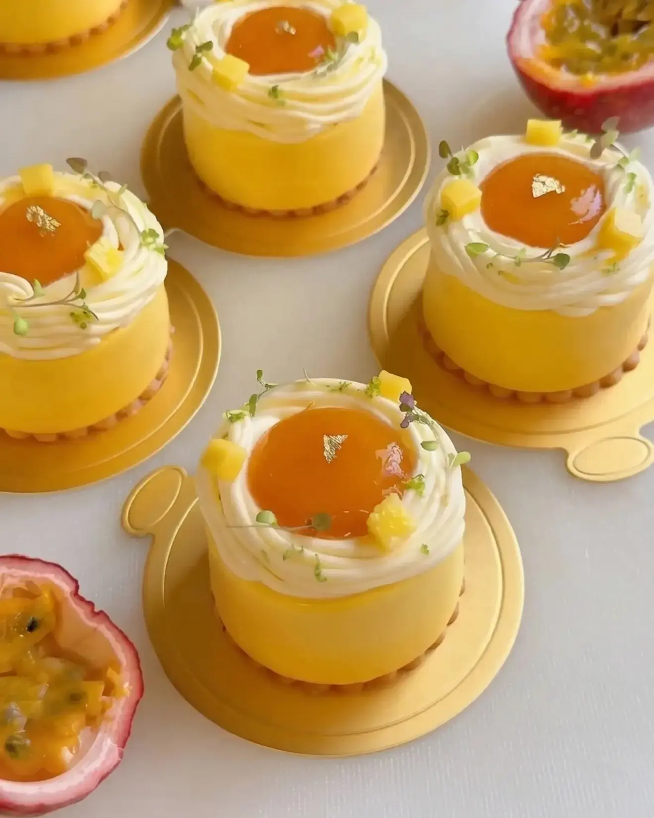 Mango Passion Fruit Coconut Entremet, With mango coconut mousse, mango passion fruit compote, vanilla sponge, passion fruit cremeux, and lime whipped ganache
