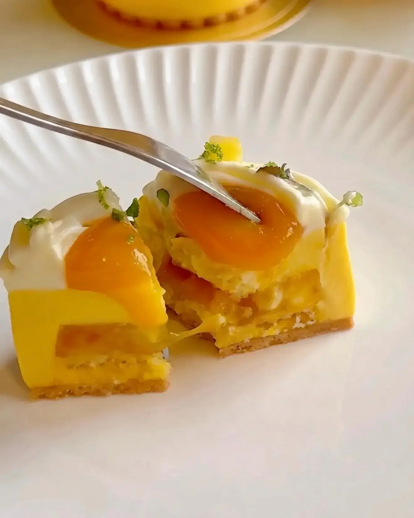 Mango Passion Fruit Coconut Entremet, With mango coconut mousse, mango passion fruit compote, vanilla sponge, passion fruit cremeux, and lime whipped ganache